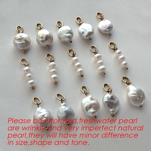 Baroque freshwater pearl and triple round pearl pendants in golden finish on white background