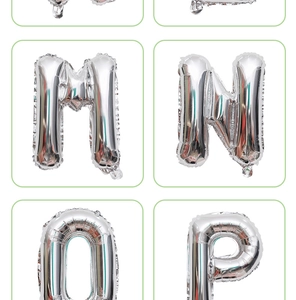 Macro detail of silver foil alphabet balloons letters M N O P with metallic gloss