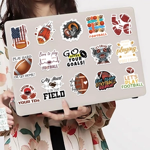 Cartoon rugby stickers set on a laptop featuring football helmets and sports slogans