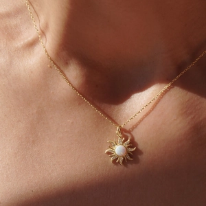 Vintage opal sun pendant necklace with micro-pushed zircons worn by model