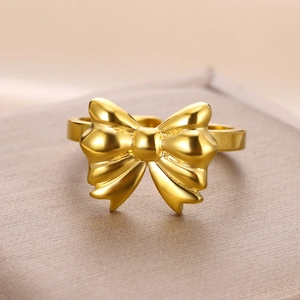 Elegant gold bow ring made of durable titanium steel with polished finish for women