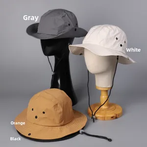 Detail of outdoor sun hats featuring adjustable windproof cords and ventilation eyelets