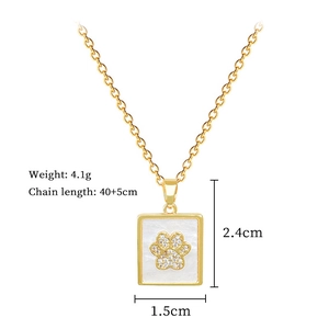 Detail shot of a square shell necklace with cat paw diamonds and product dimensions