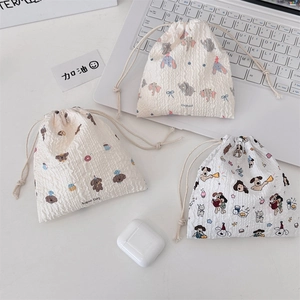 Detail of cute cartoon drawstring bags with unique crinkle texture and cotton cords