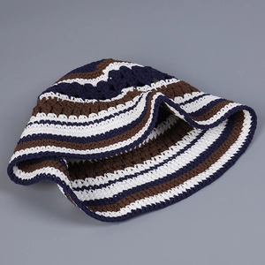 Detail of handmade crochet hollow knit bucket hat with blue and brown stripes