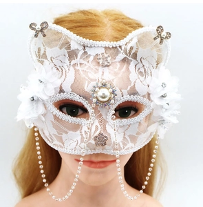 Detail view of white lace cat ear mask with pearls, rhinestones, and hanging tassel chains