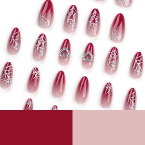 Red gradient almond press-on nails with silver spider web and heart rhinestone design