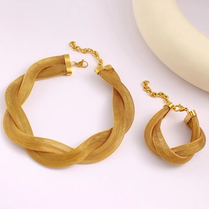 Detail of golden mesh twisted necklace and bracelet set with lobster clasp closure