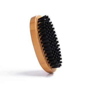 Curved wooden beard brush for men with soft black bristles on a clean white background