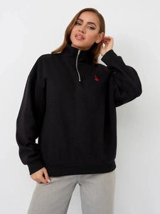 Black oversized half-zip sweatshirt with red heart embroidery on the chest, casual style