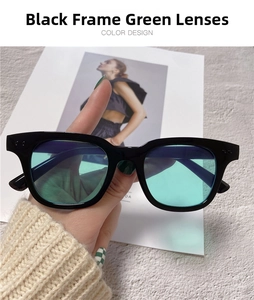 Detail shot of vintage square black sunglasses with translucent green lenses