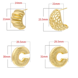 Macro display of four gold-plated C-shape earrings with textured and woven details