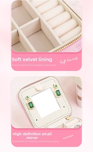 Pink travel jewelry box detail with beaded velvet lining and built-in HD vanity mirror