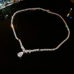 Elegant silver V-shaped necklace featuring a pear-shaped zircon pendant and sparkling stones
