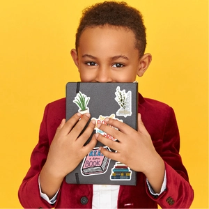 Close-up of reading-themed stickers with quotes on a notebook for kids and students