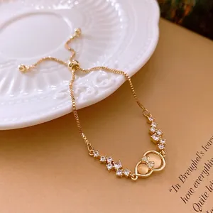 Adjustable gold zircon gourd bracelet with bow detail and elegant box chain design