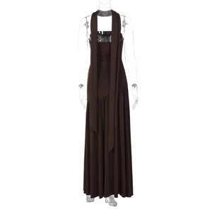 Detail of elegant dark brown tube dress featuring a flowing halter scarf and side slit