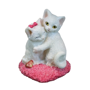 Resin cat figurine featuring white cats on a pink rose base with red heart charm