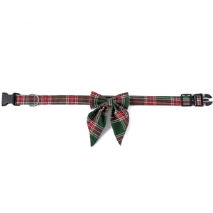 Close-up of red and green plaid Christmas dog collar with bow tie and metal D-ring