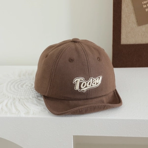 Close-up of brown baby soft-brim cap with Today embroidery and premium cotton texture