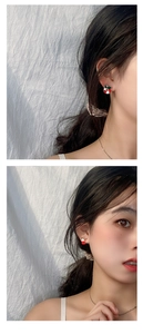 Detail of Christmas wreath and reindeer hat earrings worn on model for festive look