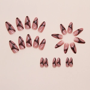 Almond press-on nails with shimmering nude base and brown irregular geometric patterns