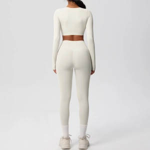 Back view of yoga set featuring long sleeve crop top and high-waist leggings in cream white