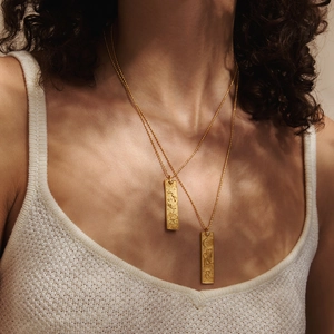 18K gold plated tarot necklace with zodiac signs embossed on rectangular pendants