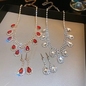 Detailed comparison of red gold and clear silver water drop tassel jewelry sets