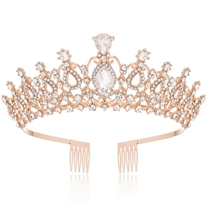 Macro detail of rose gold bridal crown with pear-cut crystals and side hair combs