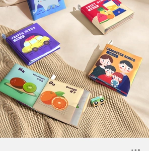 Detailed close-up of soft baby cloth books with bilingual English and Chinese cognition themes