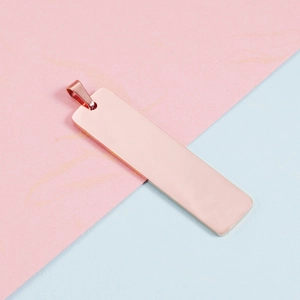 Close-up of rose gold rectangular stainless steel pendant with smooth mirror finish
