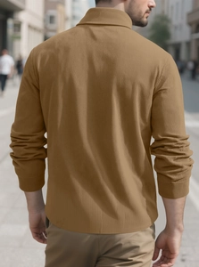 Detail view of brown corduroy jacket back texture and tailored fit for men