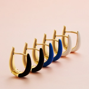 Three pairs of U-shaped enamel hoop earrings in black blue and white with 18K gold plating