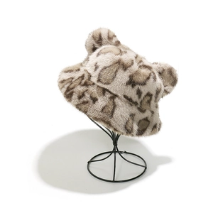 Detailed close-up of plush leopard print bucket hat with cute bear ears and faux fur texture