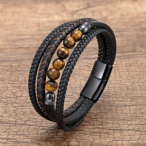 Detail of multi-layer braided leather bracelet with tiger eye beads and magnetic clasp