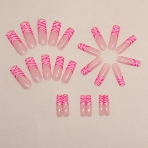 Pink zebra print French tip press-on nails in long coffin shape with transparent base