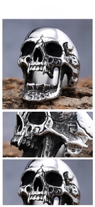 Macro shot of Gothic skull ring with detailed long teeth in polished stainless steel