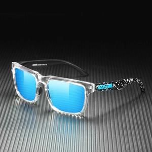 Close-up of polarized sunglasses with blue mirrored lenses and black and white splash ink temples
