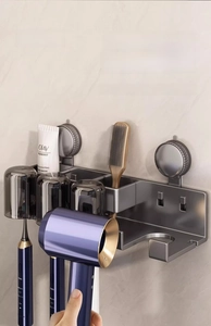 Detail of suction-cup wall mount hair dryer holder and toothbrush organizer in gunmetal gray