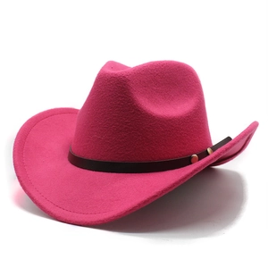 Detail of rose red felt cowboy hat with brown leather band and gold buckle fastener
