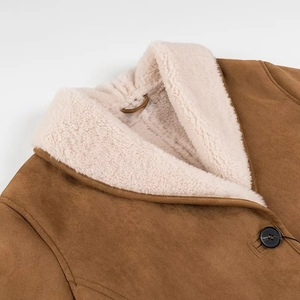 Detail of brown faux suede jacket with white shearling collar and dark round button