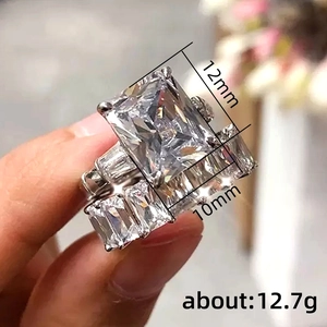 Luxury emerald cut wedding ring set with 12x10mm main stone in polished silver finish