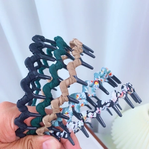 Fluffy fabric wrapped wavy headbands with inner teeth in assorted colors and floral patterns