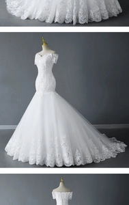 Detail of off-shoulder lace wedding dress featuring sequined floral lace and corset back