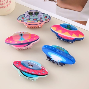 Detail showing five colorful UFO and alien hair claws in various vibrant acrylic colors