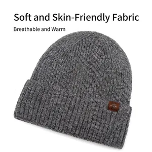 Dark grey ribbed knit beanie for men with brown faux leather snowflake patch detail