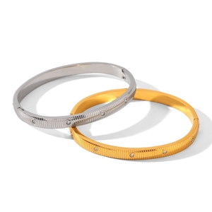 Luxe striped stainless steel bangle with inlaid zircons in gold and silver finish