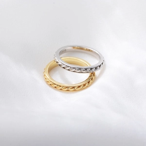 Polished S925 sterling silver and gold plated twisted rope rings on white silk