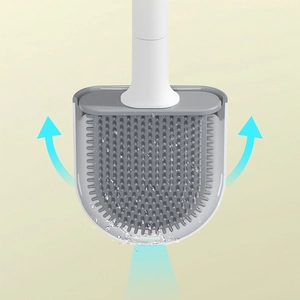 Gray silicone toilet brush with white handle in ventilated base showing quick-drying design